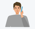 困って電話をしている男性